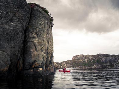 The fjord is flanked by steep-sided cliffs for much of its length | Photo: FE