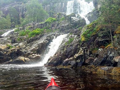 There are many spectacular waterfalls to visit as you paddle the fjord | Photo: Liepa Macikenaite