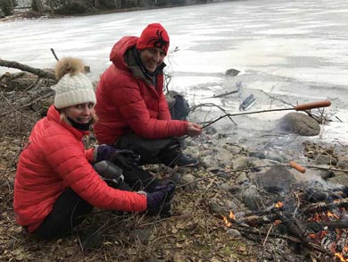 Grilling sausages by the campfire | Photo: Julian Aldrige