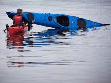 The course will teach you how to re-enter your kayak after a capsize | Photo: J. Hermansson